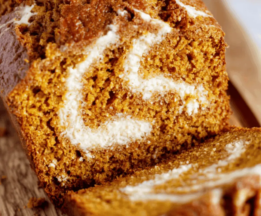 Delicious homemade pumpkin bread with creamy cream cheese swirl, perfect for fall desserts and holiday baking