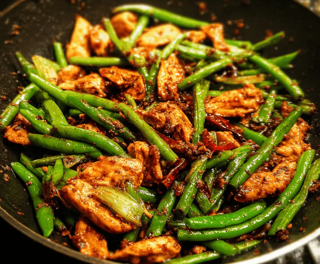 Colorful chicken and green bean stir-fry served in a bowl, featuring tender chicken pieces, vibrant green beans, and a savory sauce, perfect for a quick and healthy meal.