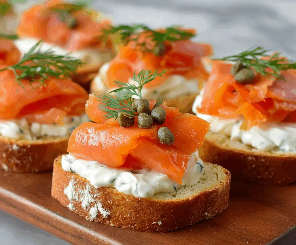 Delicious smoked salmon appetizer garnished with fresh herbs and lemon slices, perfect for parties and gatherings.