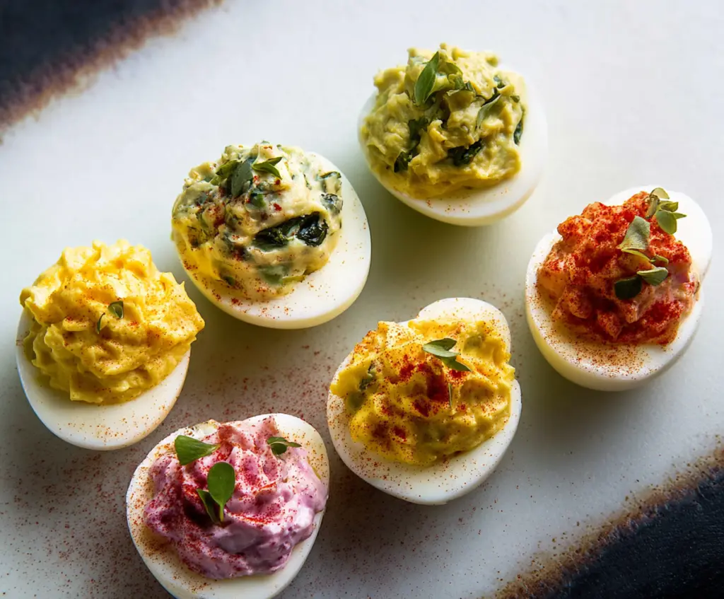 Easter Deviled Eggs Three Ways with colorful toppings for festive celebration